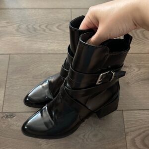 Black buckle patent ankle boots